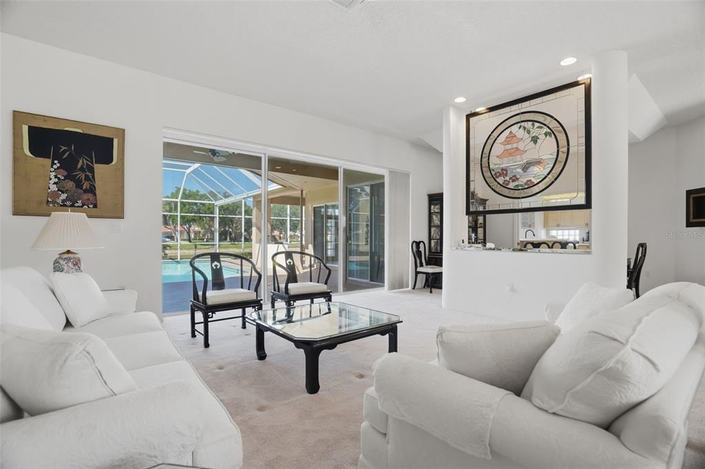 A single-story brick house with a white underlayment roof and a two-car garage — 3166 STERLING STREET, TARPON SPRINGS, FL