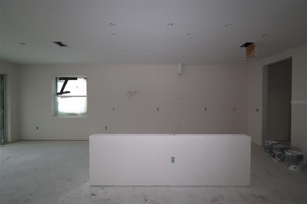 A two-story house under construction with concrete block walls and wood-framed upper levels — 17043 OVERSTORY ROAD, ORLANDO, FL