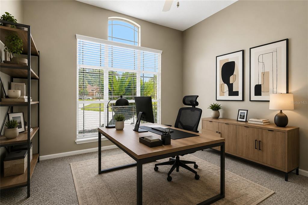 A home office features a wooden desk, a black chair, a bookshelf, and a window — 1413 COURSE VIEW, FLEMING ISLAND, FL