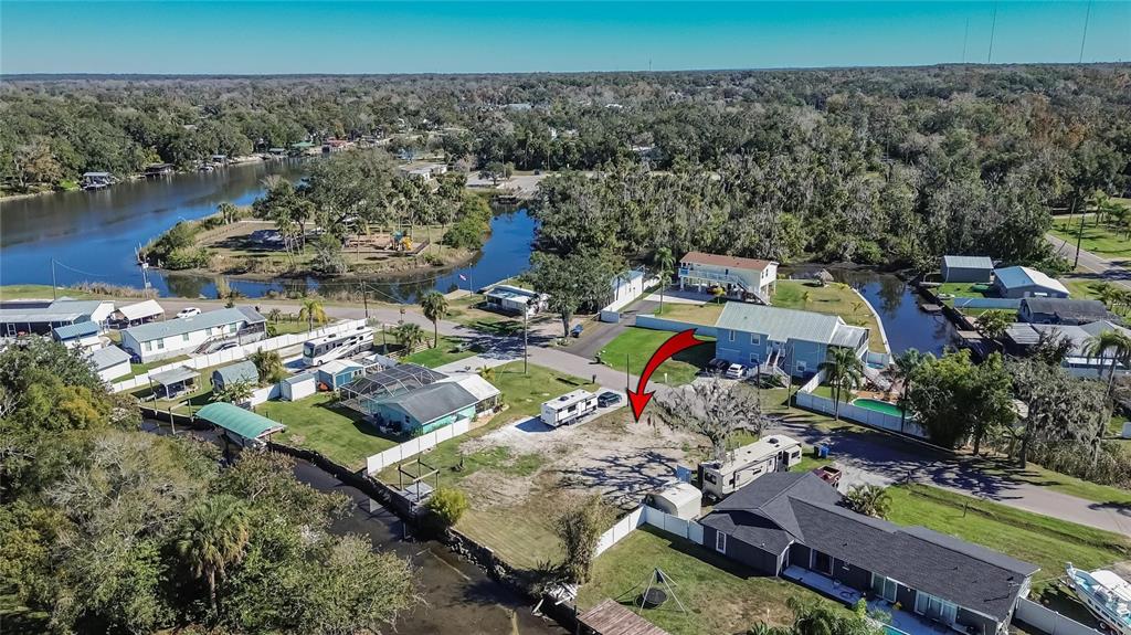 An aerial view shows a vacant residential lot with two RVs parked on the property — 8615 PARKWAY CIRCLE, RIVERVIEW, FL