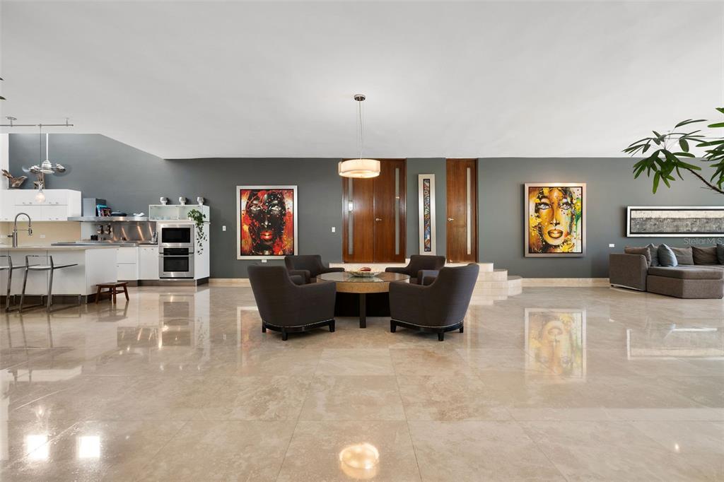 A spacious open-concept living area features polished tile floors, dark gray walls, and modern furniture — PR 8860 km 1.6 KM  1.6, TRUJILLO ALTO, PR