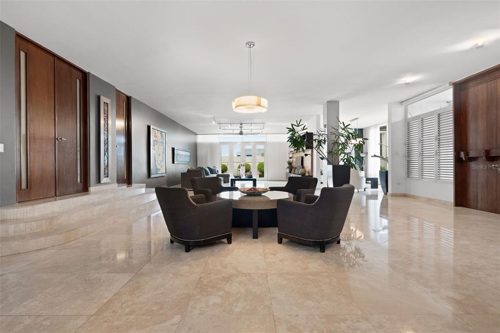 A spacious living room features light tile floors, dark gray walls, and a central seating area — PR 8860 km 1.6 KM  1.6, TRUJILLO ALTO, PR