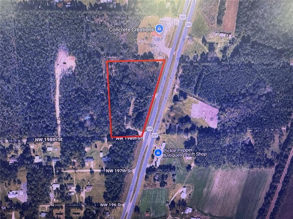 This is an aerial map showing a triangular parcel of land outlined in red — 19978 N HIGHWAY 301, STARKE, FL