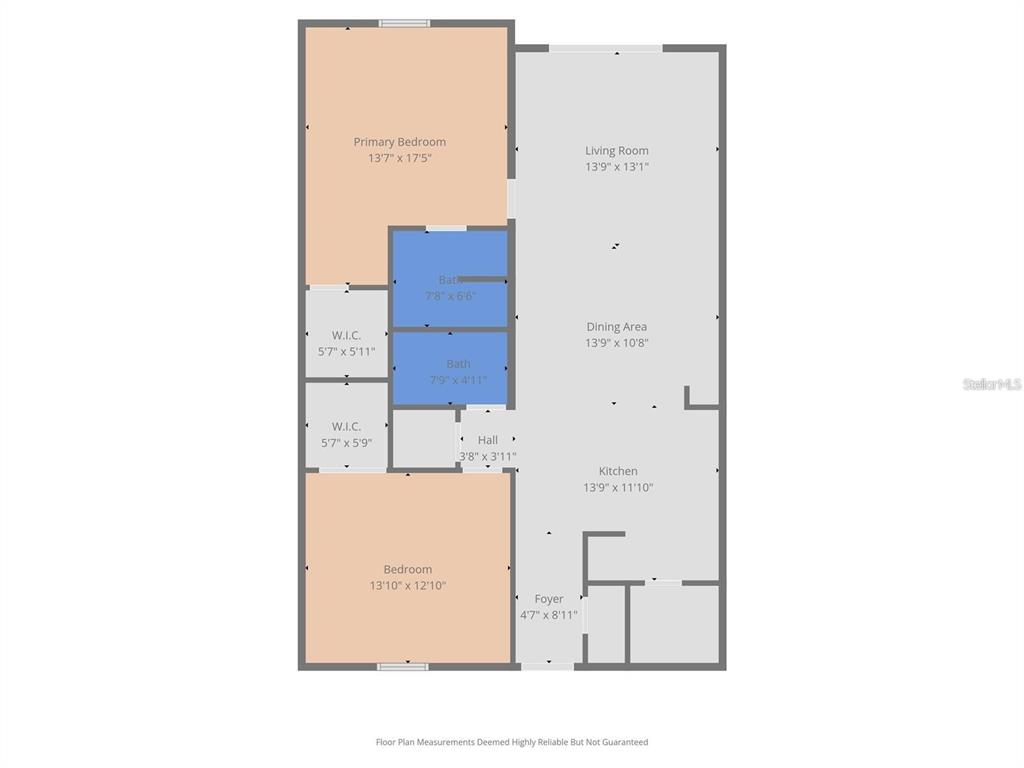 A kitchen features white cabinets, stainless steel appliances, marble-style backsplash, and a laundry room doorway — 3505 TARPON WOODS BOULEVARD UNIT G405, PALM HARBOR, FL