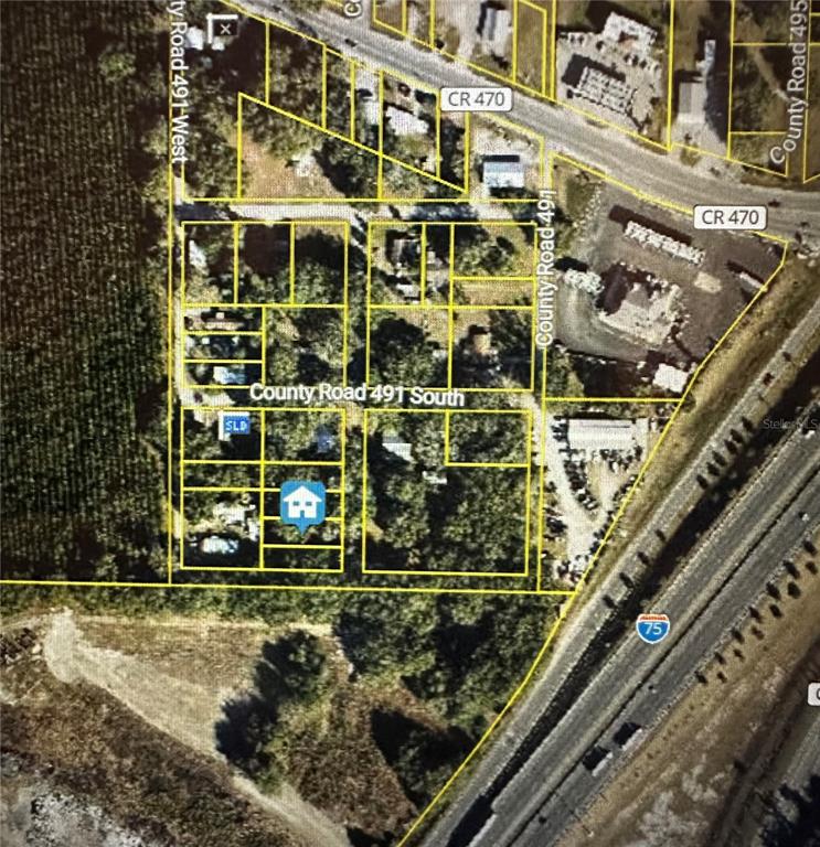 This is an aerial map showing property boundaries and road layouts near an interstate highway — LOT #5, LAKE PANASOFFKEE, FL