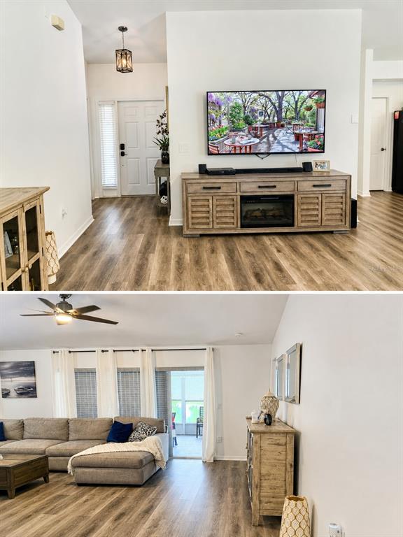 This living room features wood-look flooring, a wall-mounted television, a fireplace console, and a sectional — 9645 ROLLING CIRCLE, SAN ANTONIO, FL