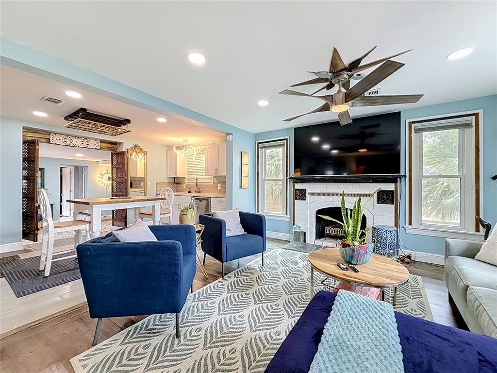 A white front door with a decorative glass insert sits above brick steps — 4831 FAIRFIELD AVENUE S, ST PETERSBURG, FL