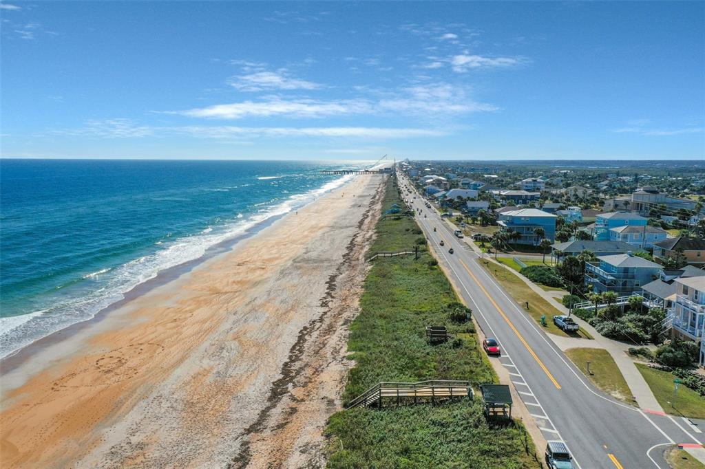 An aerial view of a coastal road running parallel to a sandy beach and ocean — N OCEAN BOULEVARD, FLAGLER BEACH, FL