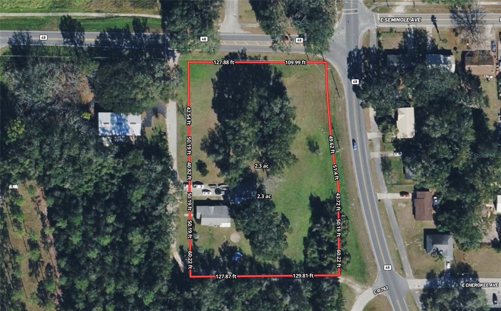 This is an aerial map showing a rectangular property lot with dimensions and acreage — 309 S CENTER STREET, BUSHNELL, FL