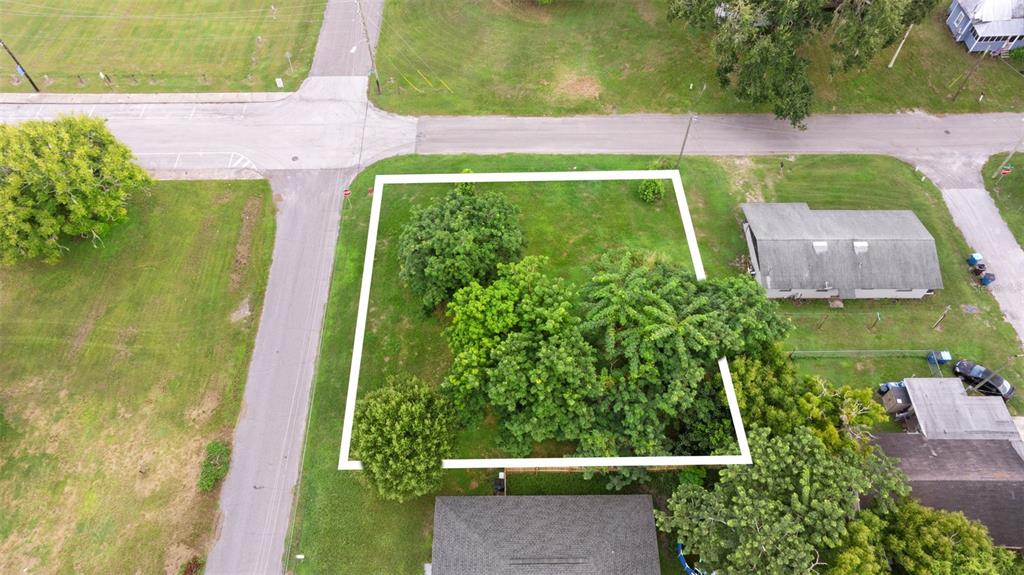 An aerial view shows a vacant residential lot outlined in white near a street intersection — FRENCH AVENUE S, FORT MEADE, FL