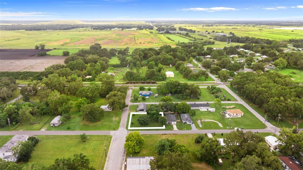 An aerial view shows a residential property lot outlined in white within a rural neighborhood — FRENCH AVENUE S, FORT MEADE, FL