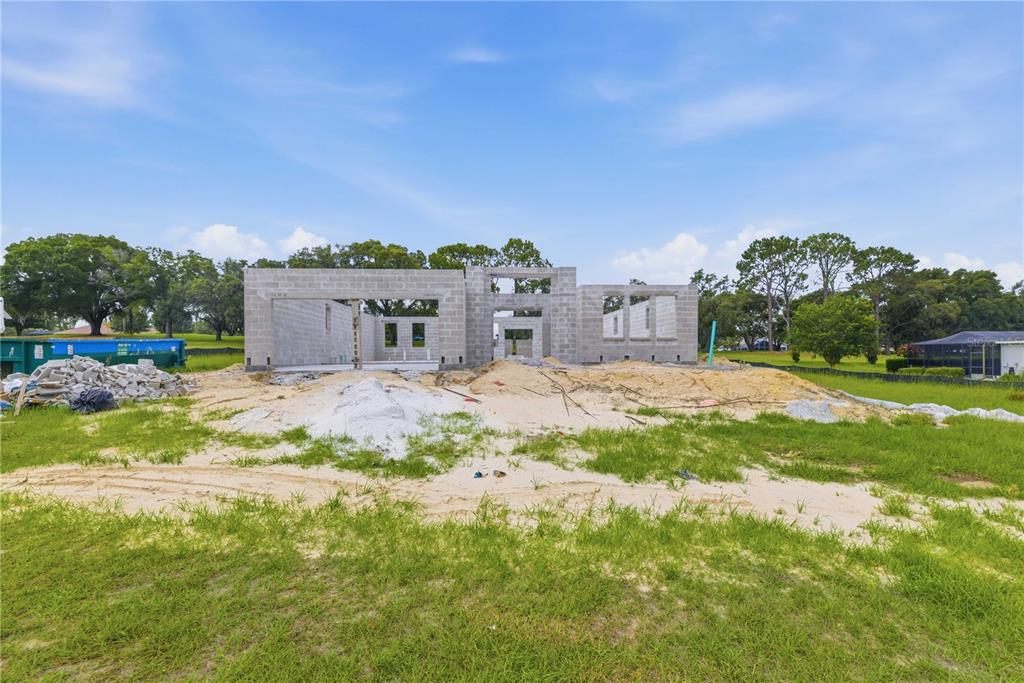 This is a digital rendering of a single-story house with a stone facade and garage — 804 E EPSOM COURT, HERNANDO, FL