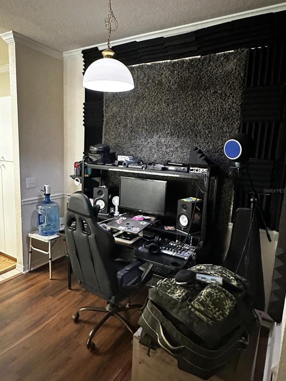 A home office setup features a computer desk, gaming chair, and acoustic foam wall panels — 3605 CONROY ROAD UNIT 524, ORLANDO, FL