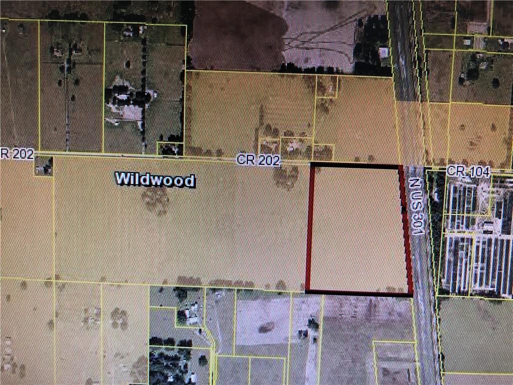 This is a satellite map view showing a parcel of land outlined in red — US HIGHWAY 301, OXFORD, FL