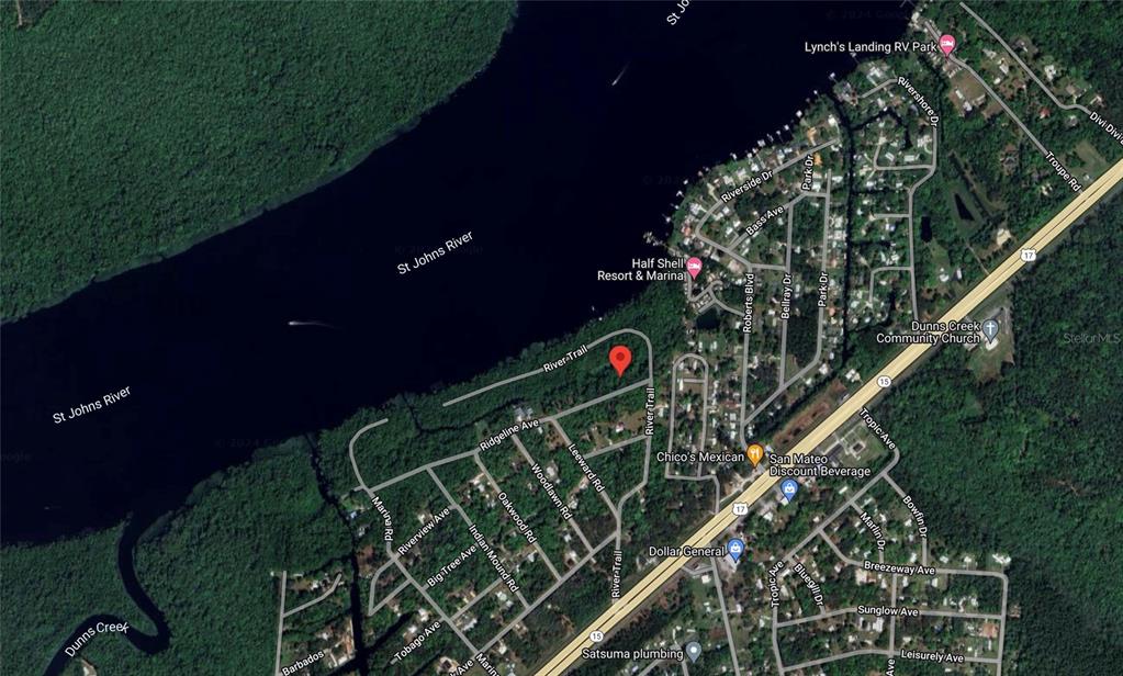 This is a satellite map view of a residential area along the St. Johns River — 102 RIDGELINE AVENUE, SATSUMA, FL