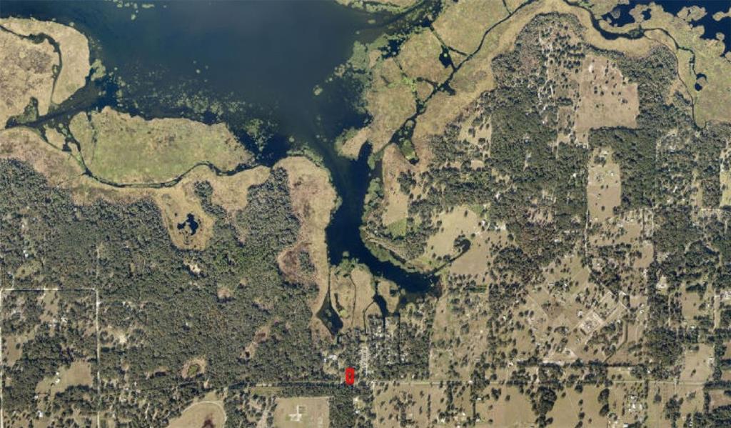 This aerial map shows a property marked with a red pin near a large lake — 0 W HIGHWAY 318, CITRA, FL