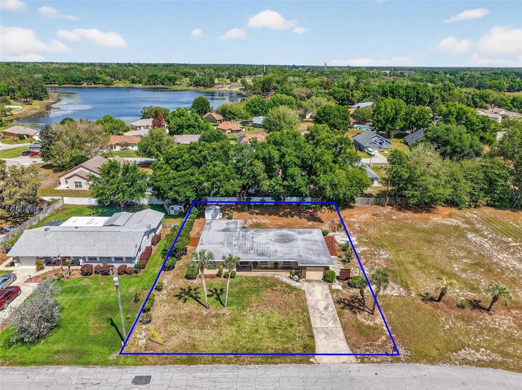 An aerial view shows a single-story house with a flat roof on a large lot — 17923 FLORIDA STREET, UMATILLA, FL