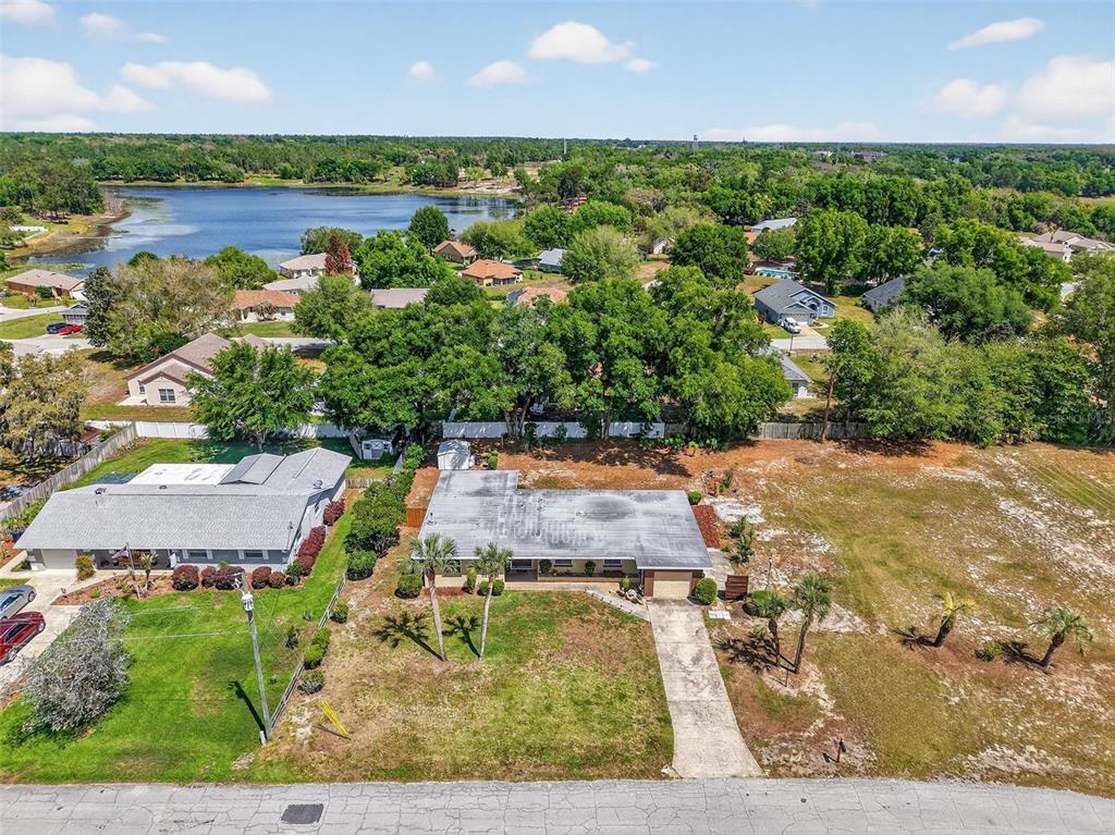 An aerial view shows a single-story house with a flat roof and a large yard — 17923 FLORIDA STREET, UMATILLA, FL