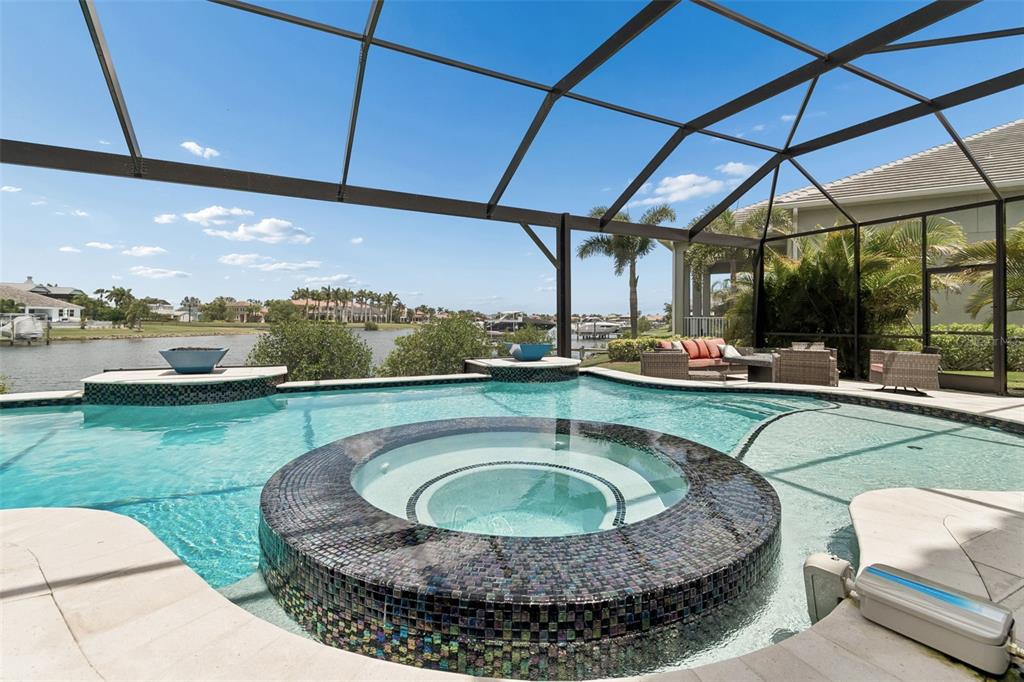 An aerial view of a two-story Mediterranean-style house with a tile roof and stone facade — 823 MANNS HARBOR DRIVE, APOLLO BEACH, FL