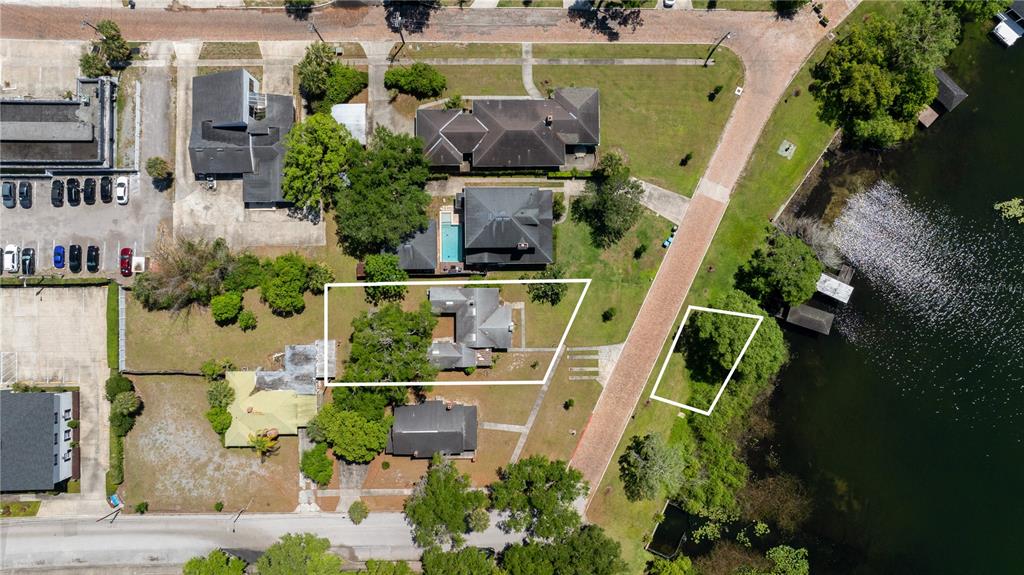 This aerial view shows a residential property with a house and a separate waterfront lot — 240 KILLARNEY DRIVE, WINTER PARK, FL