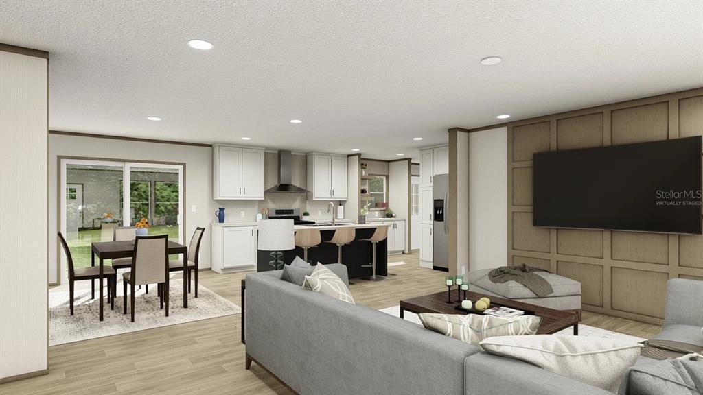 This virtual rendering shows an open-concept living room and kitchen with light wood flooring — 40390 COUNTRY ROAD, EUSTIS, FL