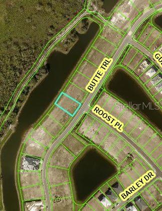 This is an aerial map showing a vacant residential lot highlighted in a subdivision — 4030 BUTTE TRAIL, BRADENTON, FL
