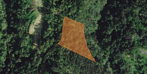 An aerial view shows a highlighted parcel of land surrounded by dense forest — HACIENDAS DEL DORADO DEV., CONTORNO WARD, FASE II, TOA ALTA, PR