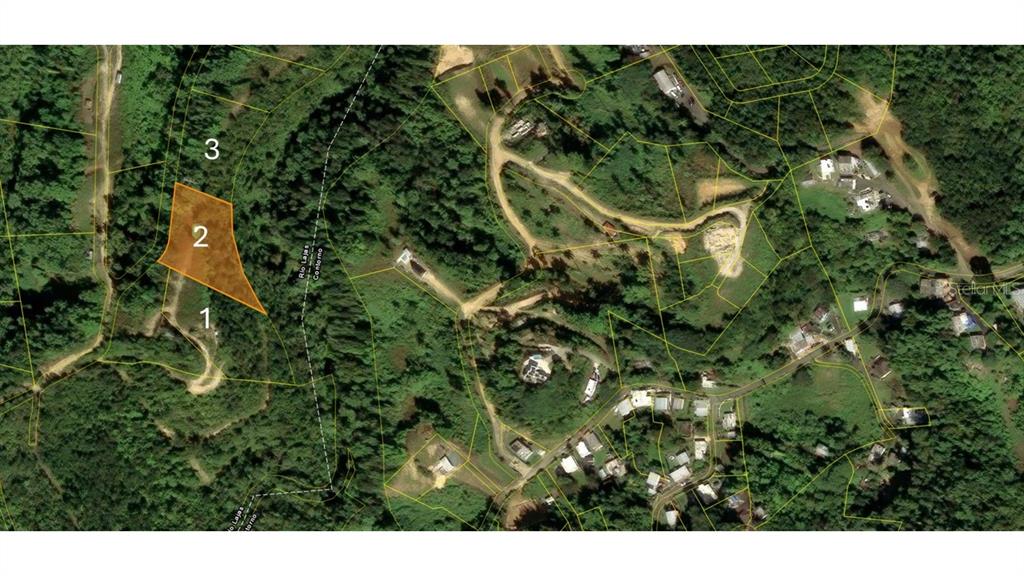 An aerial map view shows a highlighted plot of land surrounded by trees and roads — HACIENDAS DEL DORADO DEV., CONTORNO WARD, FASE II, TOA ALTA, PR