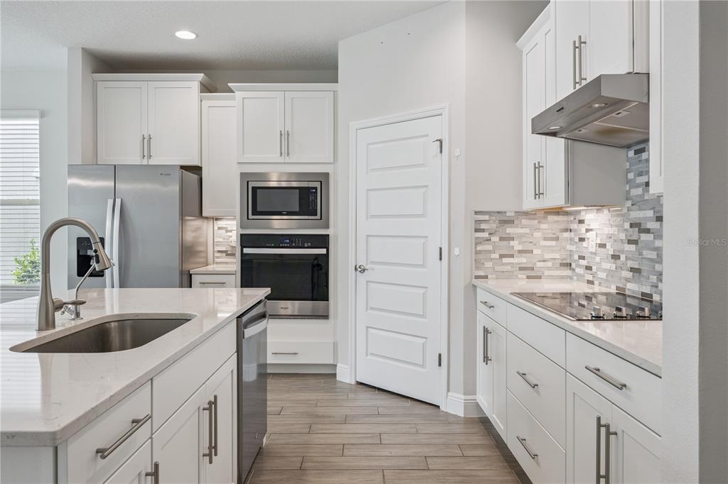 A two-story suburban house with a two-car garage and a covered front porch — 11031 JACKSON COVE, WINTER GARDEN, FL