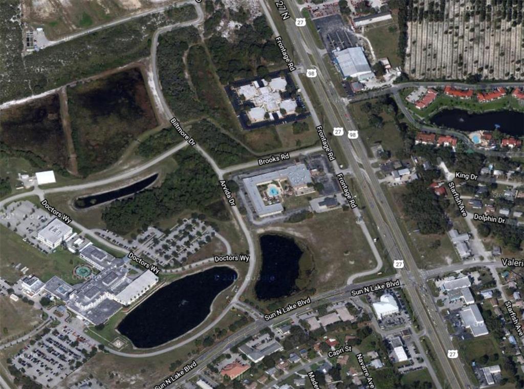 This is an aerial map view of a commercial area with roads, buildings, and ponds — 6801 US-27 N UNIT B1, SEBRING, FL