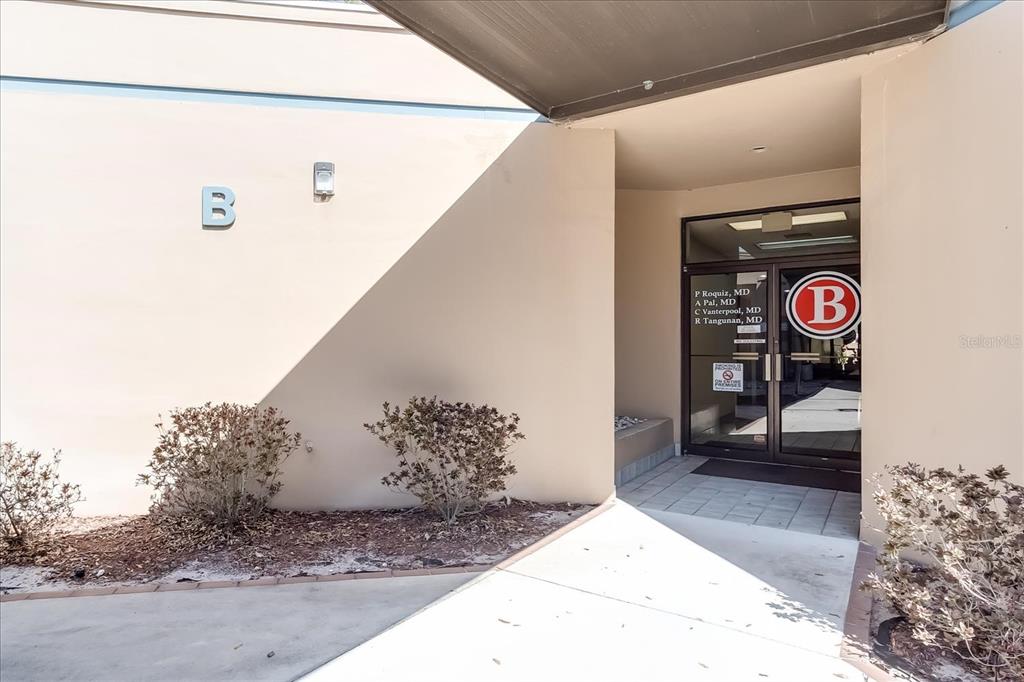 The exterior entrance to a medical office building marked with the letter B — 6801 US-27 N UNIT B1, SEBRING, FL