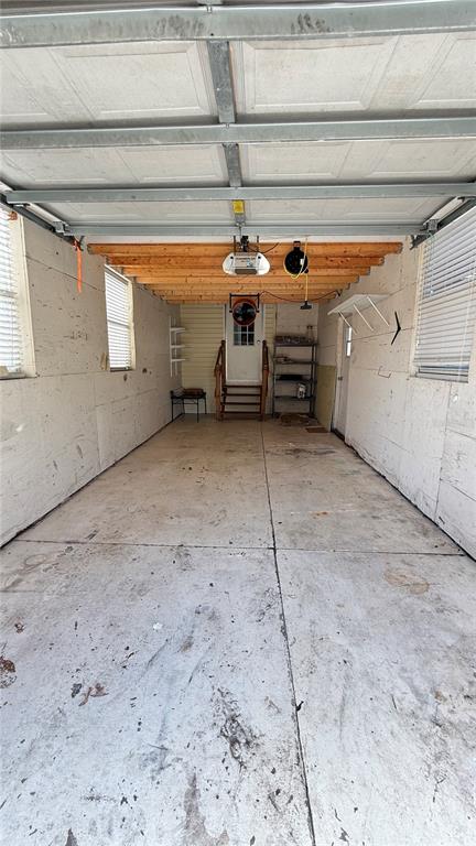 A light yellow mobile home exterior features a white vinyl fence and wooden stairs — 10404 BRUSSELS DRIVE, RIVERVIEW, FL