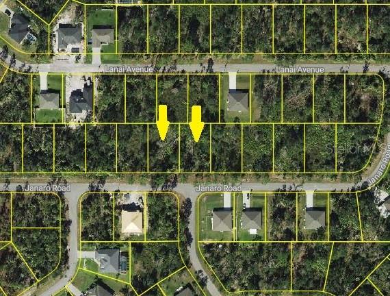 This is an aerial map showing two adjacent vacant lots highlighted by yellow arrows — JANARO ROAD, NORTH PORT, FL