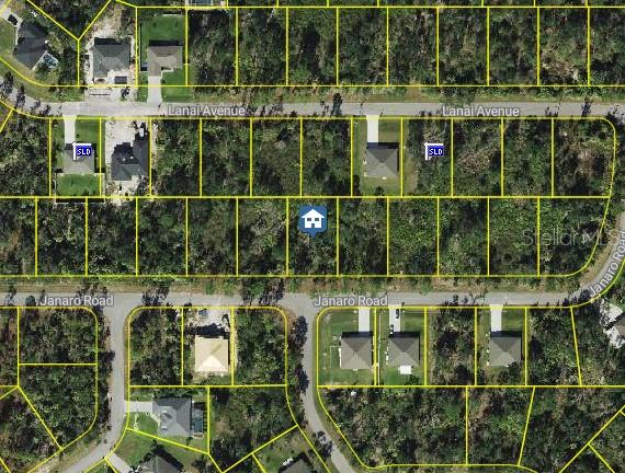 This is an aerial map showing a vacant residential lot marked with a house icon — JANARO ROAD, NORTH PORT, FL