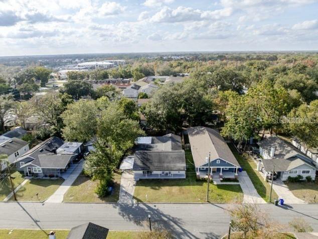 An aerial view shows several residential houses with driveways along a suburban street — 1225 KING AVENUE, LAKELAND, FL