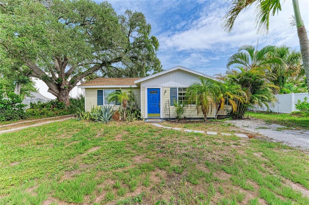 An aerial view shows a single-story house with a brown roof circled in a white oval — 1300 LOMA LINDA COURT, SARASOTA, FL