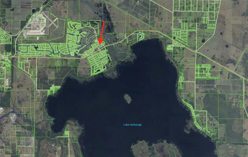 This map shows a residential area with a red arrow pointing to a specific lot — 208 WILDWOOD TERRACE, SEBRING, FL