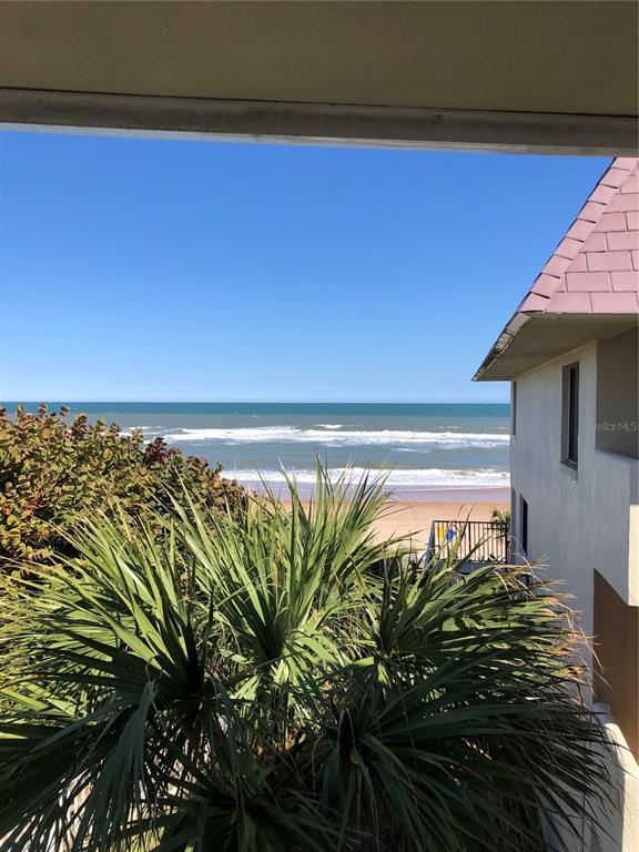 A view of the ocean and beach from a balcony next to a building — 935 OCEAN SHORE BOULEVARD UNIT 3040, ORMOND BEACH, FL