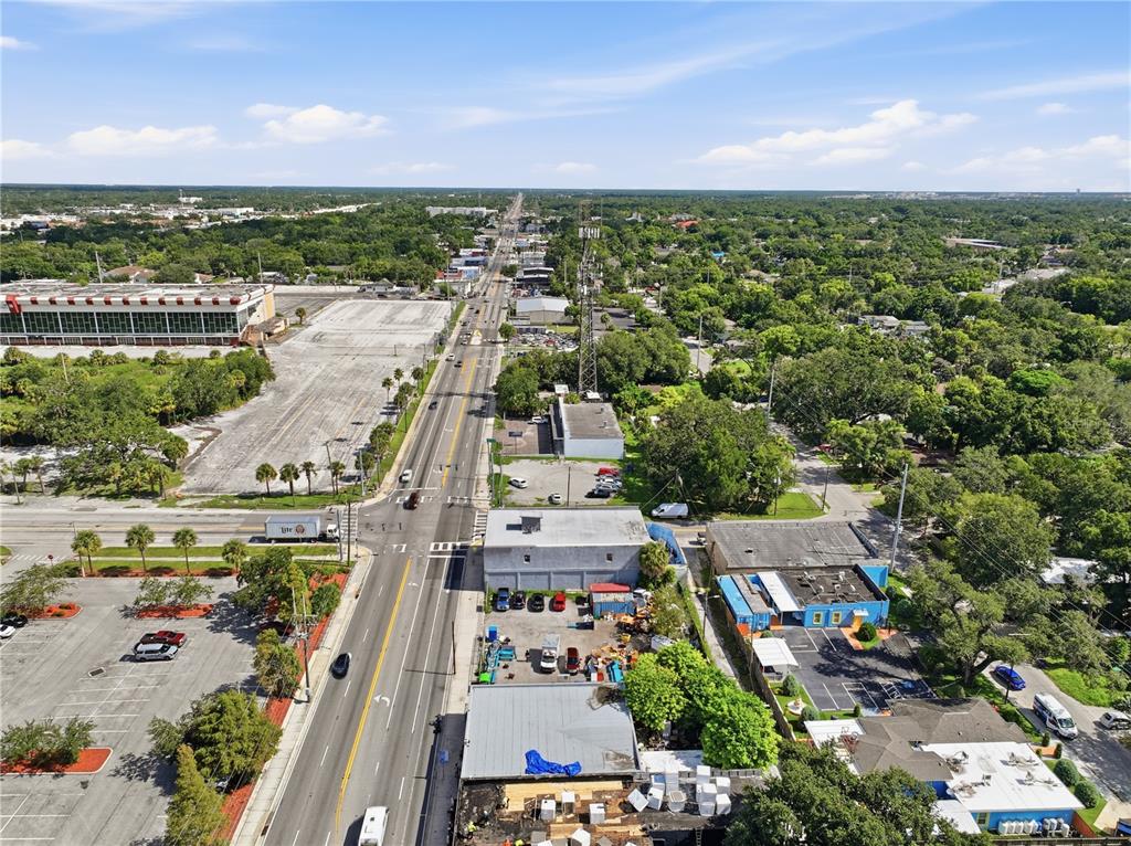 An aerial view shows a multi-lane road running through a commercial and residential area — 8145 N NEBRASKA AVE, TAMPA, FL