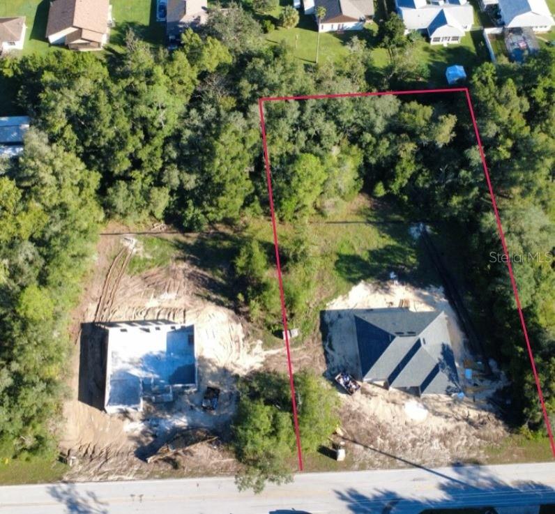 This is a floor plan showing a four-bedroom house with a garage and open living area — 21481 SW MARINE BOULEVARD, DUNNELLON, FL