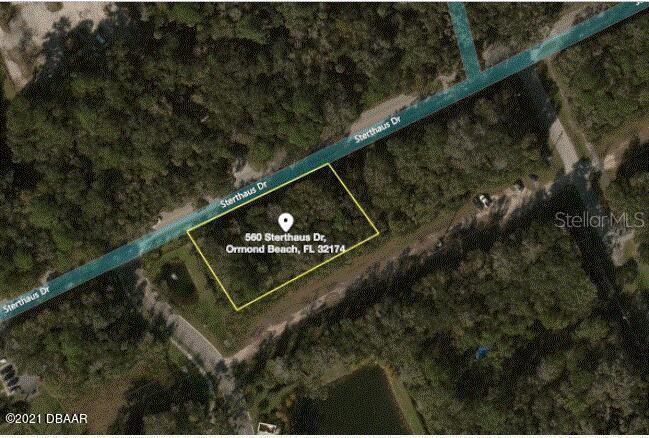 An aerial map view shows a vacant, rectangular lot outlined in yellow along a road — 560 STERTHAUS DRIVE, ORMOND BEACH, FL