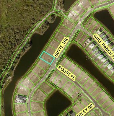 An aerial map view shows a highlighted vacant residential lot located along a curved street — 4026 BUTTE TRAIL, BRADENTON, FL