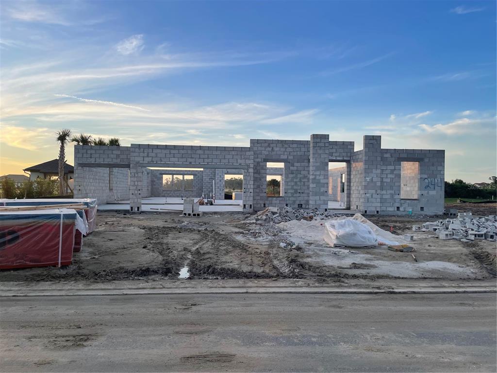 A single-story house under construction with concrete block walls stands on a dirt lot — 9030 EAGLE VIEW TERRACE, PARRISH, FL