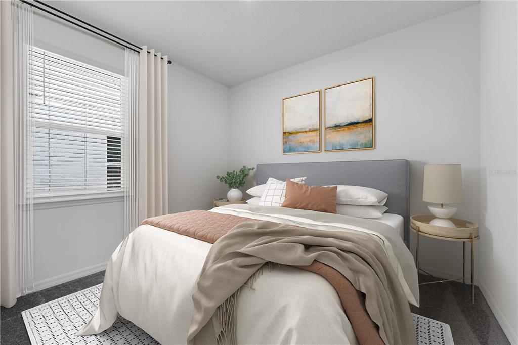 A bedroom features a gray upholstered headboard, a white bed, and two framed wall artworks — 4149 LAVENDER COURT, HAINES CITY, FL