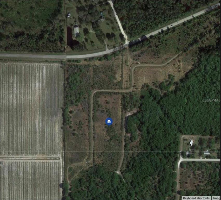 This is an aerial map view of a vacant, undeveloped plot of land — 731 S WARFIELD ROAD, AVON PARK, FL