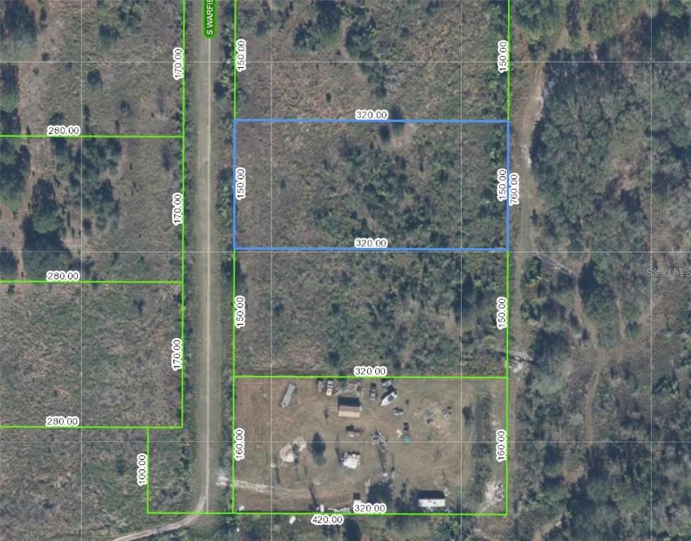 An aerial map shows two adjacent rectangular parcels of land with property boundary lines and dimensions — 731 S WARFIELD ROAD, AVON PARK, FL