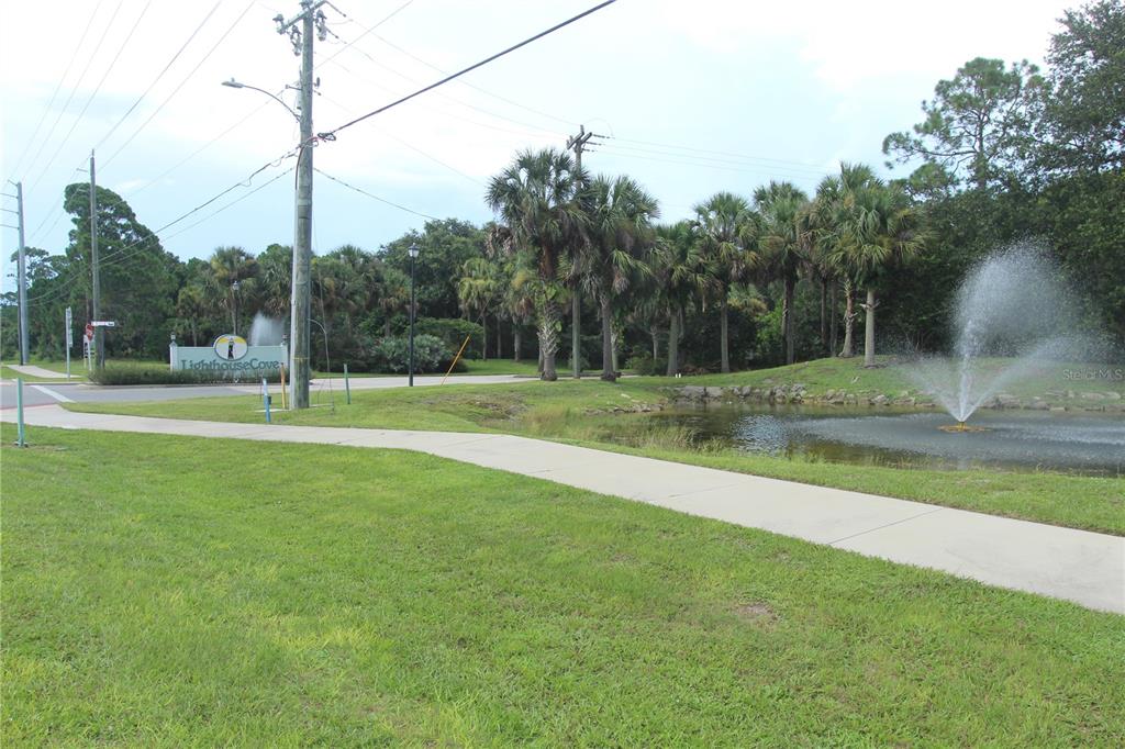 An aerial view shows a residential lot with mature trees and a house under construction — 498 SIOUX BOULEVARD, OAK HILL, FL