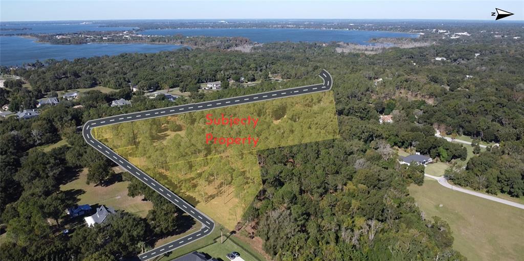 An aerial view shows a highlighted, wooded vacant lot with a road bordering the property — 6203 ALLEN STREET, MOUNT DORA, FL