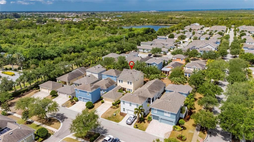An aerial view shows a suburban neighborhood with a two-story house highlighted by a marker — 508 WINTERSIDE DRIVE, APOLLO BEACH, FL