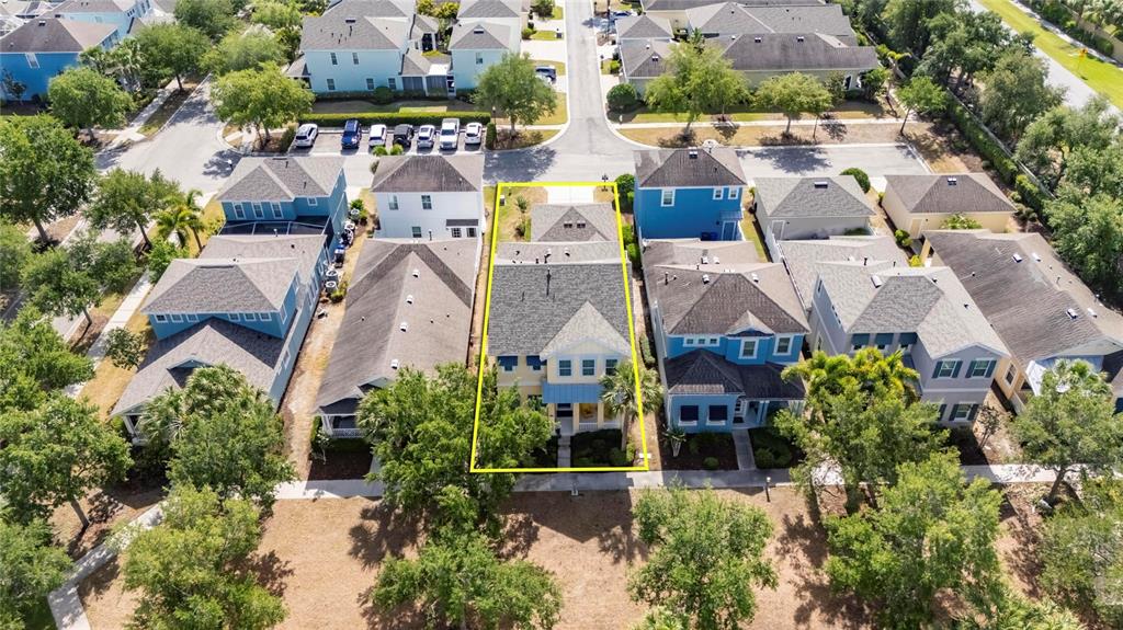An aerial view shows a yellow house highlighted in yellow within a suburban neighborhood — 508 WINTERSIDE DRIVE, APOLLO BEACH, FL